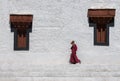 Monk walking across the wall in Hemis Monastery,Ladakh,India Royalty Free Stock Photo