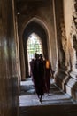 Monk walking in a hallway, Bagan