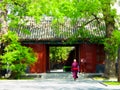 A monk walking inside the lama temple