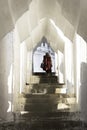 A monk walks up the steps of a Yangon pagoda