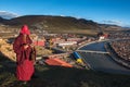 A monk at Yaqing Temple in the sunset