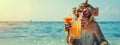 a monkey with a cocktail on the background of the beach. Selective focus Royalty Free Stock Photo