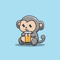 monkey drinking orange juice Royalty Free Stock Photo