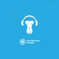 Monkey enjoys the Christmas music. Relaxing monkey in headphones. Logotype with snowflake