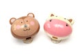 A monkey and a hippo shaped wall suction cup toothbrush holders