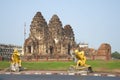 Monkey sculptures on the background of the ruins of the ancient temple Wat Phra Prang Sam Yot, Lopburi Royalty Free Stock Photo