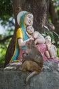 Monkey and statue Madonna and children