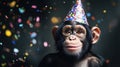 Monkey wearing a fun party hat with confetti scattered around, having Royalty Free Stock Photo