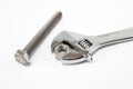 Monkey wrench and bolt and nut on white background Royalty Free Stock Photo