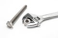 Monkey wrench and bolt and nut on white background Royalty Free Stock Photo