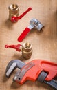 Monkey wrench and plumbing fixtures Royalty Free Stock Photo