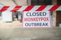 Monkeypox outbreak concept. Message paper and barriers, to closed service during the monkeypox virus outbreak