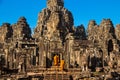 The monks in the ancient stone faces of Bayon temple