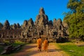 The monks in the ancient stone faces of Bayon temple