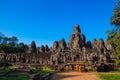 The monks in the ancient stone faces of Bayon temple, Cambodia