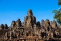 The monks in the ancient stone faces of Bayon temple, Cambodia