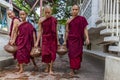 The monks carrying their drinking water at biggest Buddhism monarchy in Mandalay, Myanmar