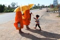 Monks Collecting Alms in Cambodia