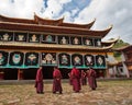 Monks debating before the monastery
