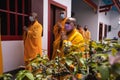 The monks escort the visitors and congregation while praying