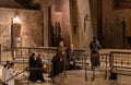 The monks after finishing prayer leave main altar of the Church of the Annunciation in the Nazareth city in northern Israel Royalty Free Stock Photo