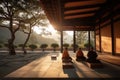 monks meditating in quiet courtyard, with view of the sunrise