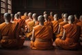 monks meditating in row, with their backs turned to each other