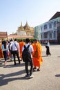 Monks and other young visitors explore National Palace