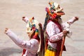 Monks perform a religious masked dance of Tibetan Buddhism