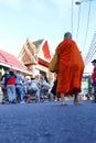 Monks Pindapata walking past to Buddhist Ordination procession