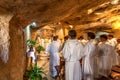 Monks pray in Grotto of Gethsemane.