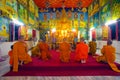 Monks praying in temole