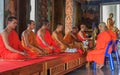 Monks praying in Wat Kaew Korawaram Temple