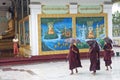 Monks in rain at shwedagon paya temple yangon myanmar Royalty Free Stock Photo