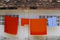 Monks' robes hanging at a temple wall Royalty Free Stock Photo