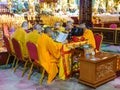 Monks say a prayer in a buddhist Temple 33 statues of guanyin in the Sanya Nanshan Cultural Center
