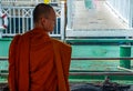 The monks stood on the Chao Phraya Express Boat to travel by water to the temple