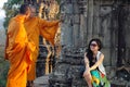 Monks and traveler in Cambodia