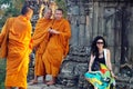 Monks and traveler in Cambodia