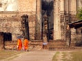 Monks visiting Wat Si Chum in Old Sukhothai Thailand