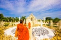 Monks visiting white temple Wat Rong Khun temple in Chiang Rai,