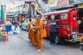 Monks waiting for alms