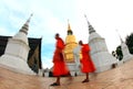 Monks walk pass Pagoda
