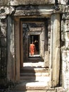 Monks walk through passageways at Bantaey Kdei, Cambodia
