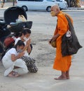 Monks blessing people