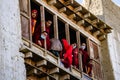 Monks watching the ancient Tibetan Buddhist Tiji Festival from the balcony in Lo Manthang, Nepal