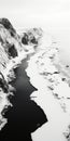 Monochromatic Aerial View: Winter Badlands And Rocky Beach