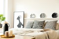 Monochromatic bedroom interior with poster