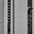A monochromatic image of architectural details creating abstract forms and shadows on a minimalist building2, Generative AI Royalty Free Stock Photo