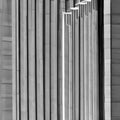 A monochromatic image of architectural elements casting abstract shadows on a minimalist structure2, Generative AI